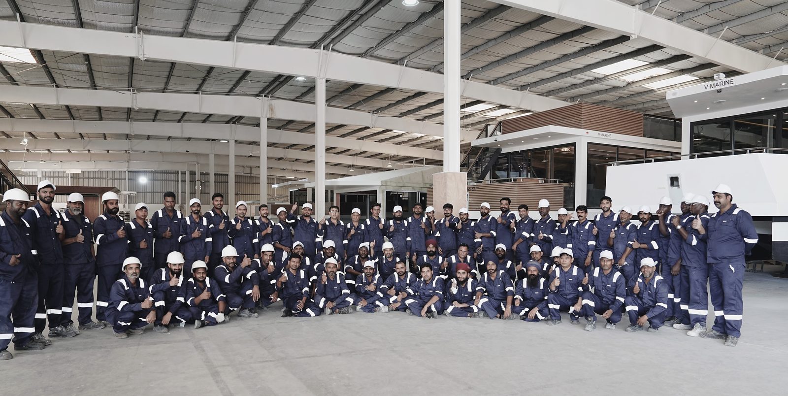 The full V-Marine team of 150 specialists gathered inside the Bahrain shipyard